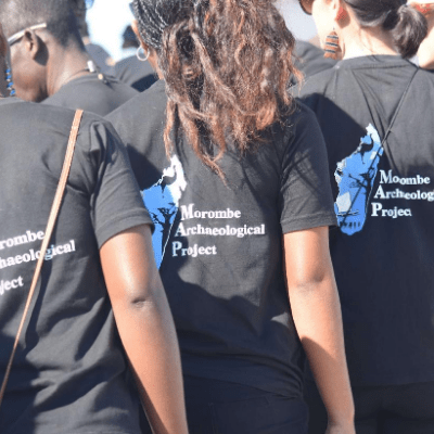 MAP Team - group of people seen from behind wearing Morombe Archaeological Project t-shirts