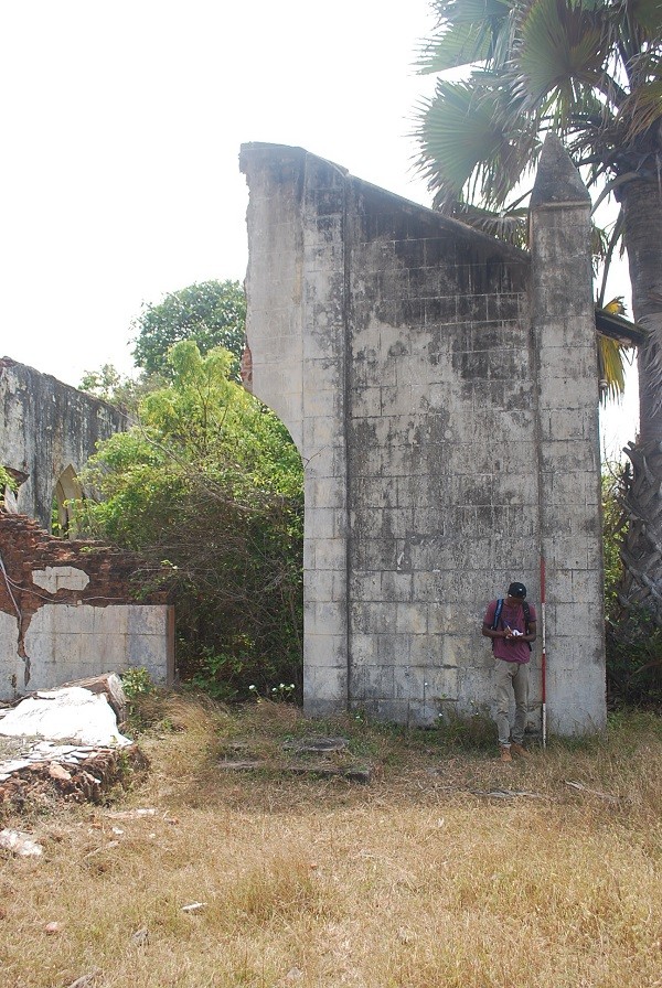 Abiola documenting Roman Catholic occupation at Topo Island, Badagry