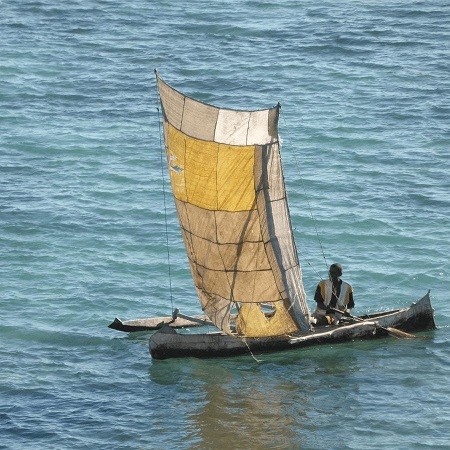 Madagascar citizen on small boat