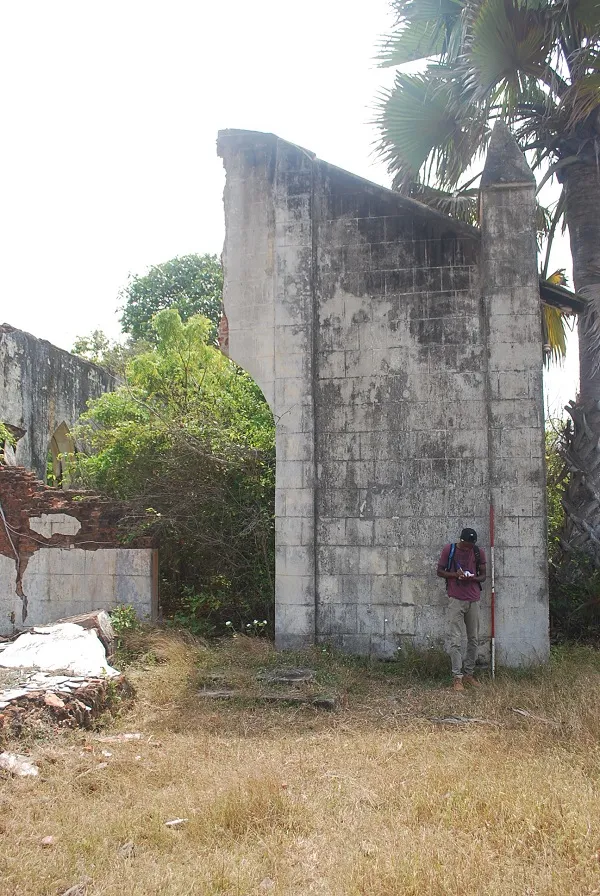 Abiola documenting Roman Catholic occupation at Topo Island, Badagry