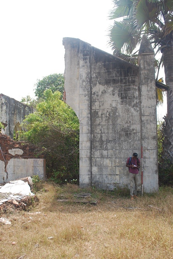 Abiola documenting Roman Catholic occupation at Topo Island, Badagry