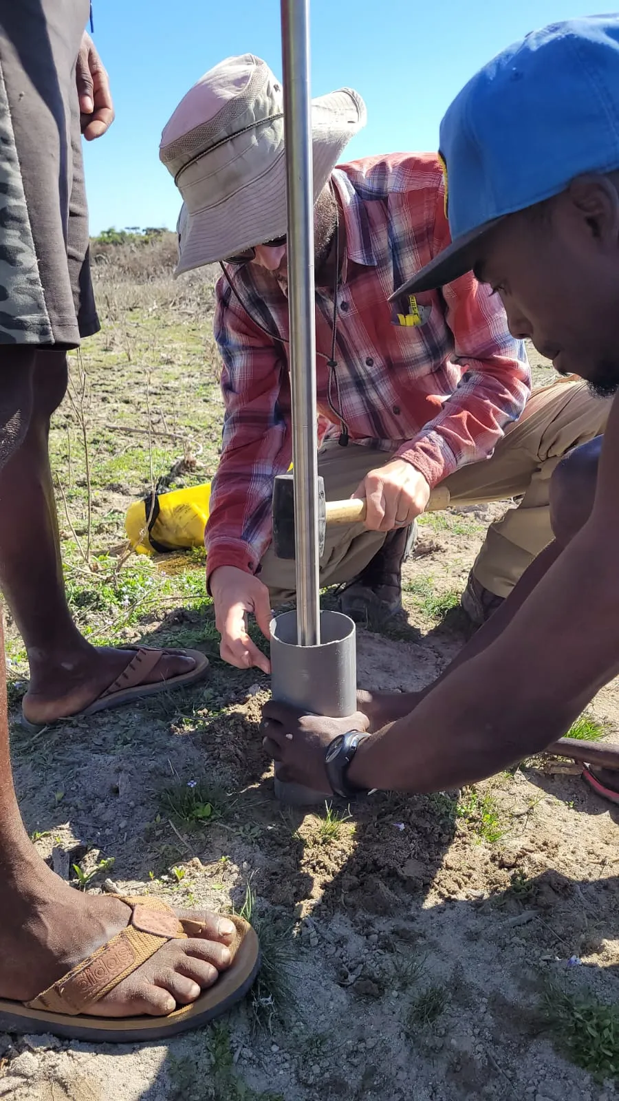 Setting up coring auger to collect soil samples for isotope analysis