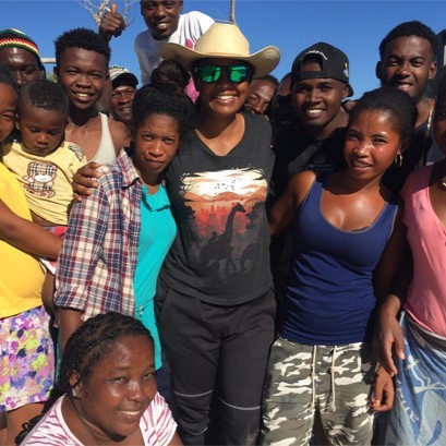 Kristina Douglass surrounded by a group of people