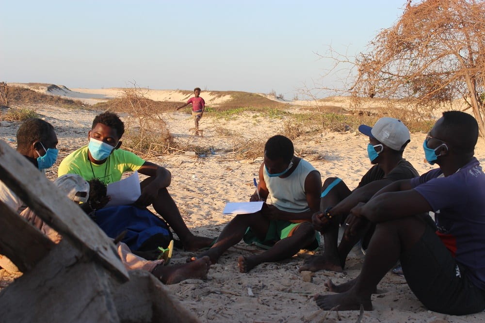 Recording archaeological materials during survey.